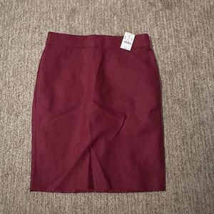 NWT J. Crew Burgundy Pencil Skirt. Never worn with tags on it. Size 4.